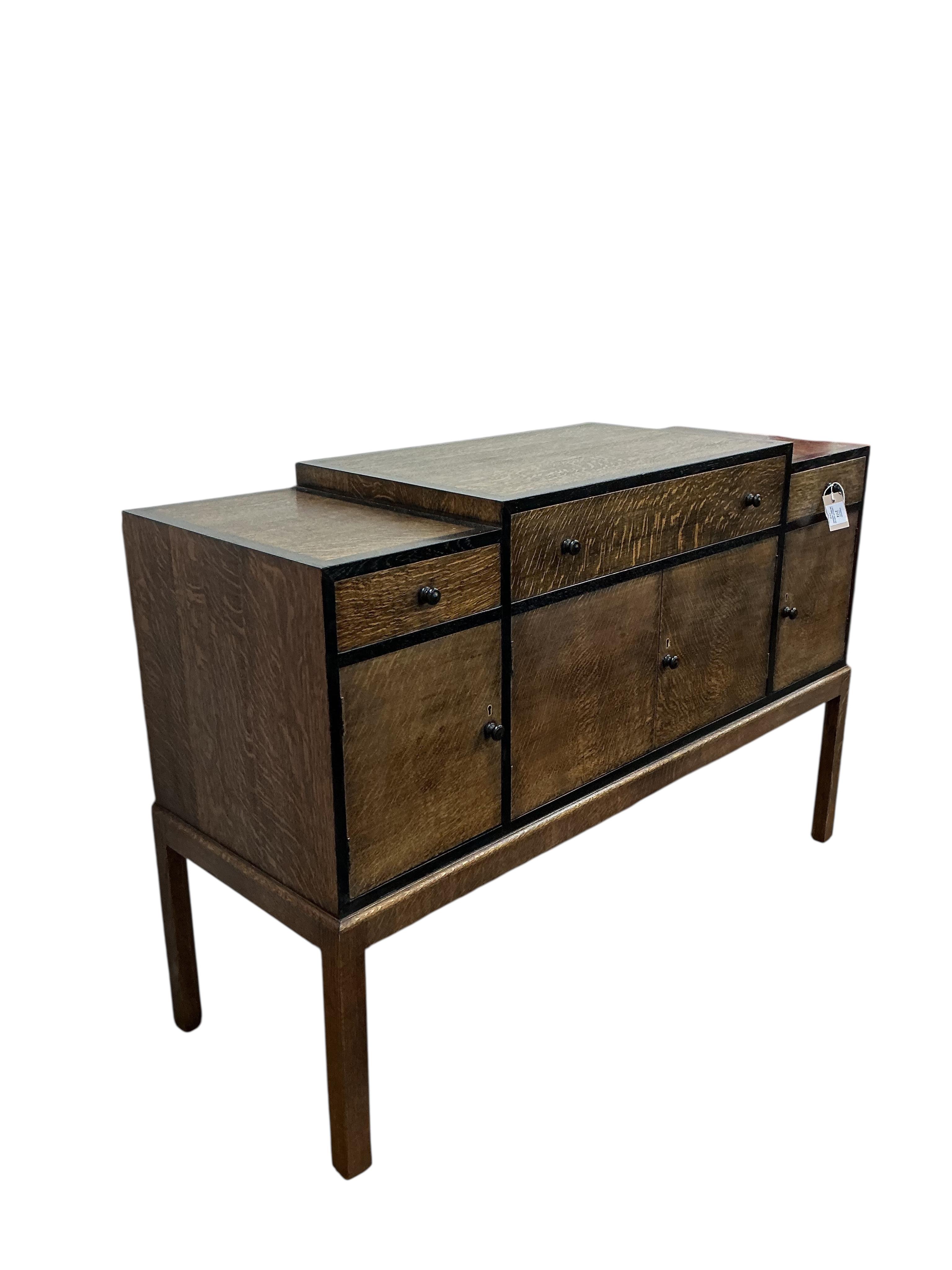 A Heals Art Deco oak and ebony sideboard, width 137cm, depth 49cm, height 92cm.